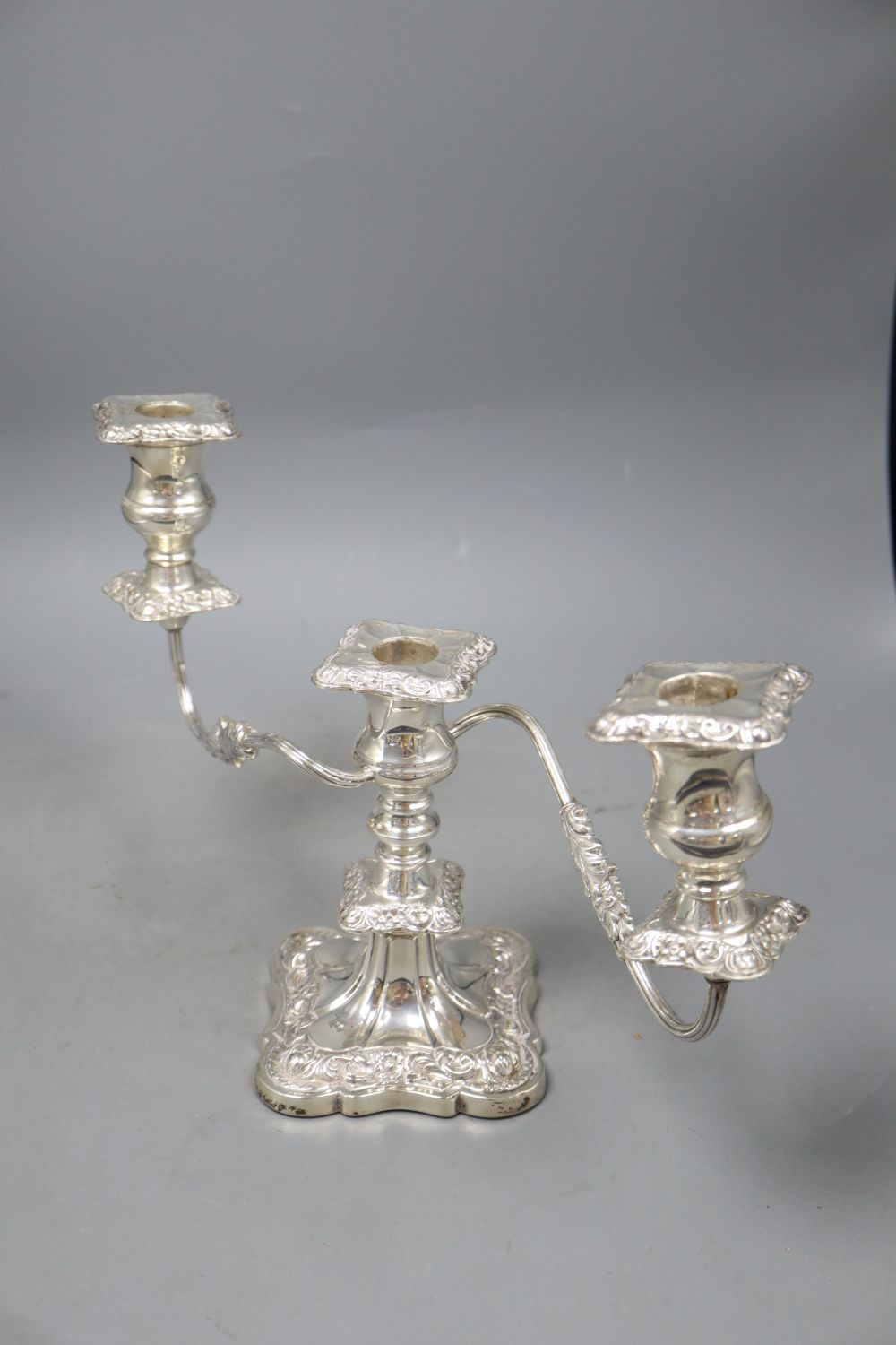 A pair of mid 20th century silver dwarf three light, two branch candelabra, Viners Ltd, Sheffield, 1956/7, weighted, height 21.4cm.